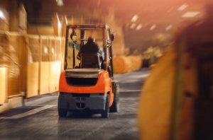 Forklift driving through a warehouse